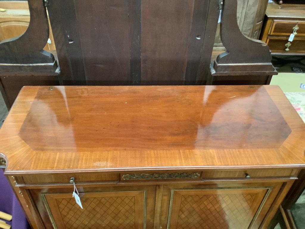 A Louis XVI style gilt metal mounted mahogany side cabinet, width 110cm depth 46cm height 110cm